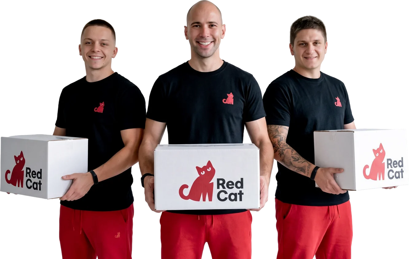 Three Red Cat movers holding Red Cat boxes